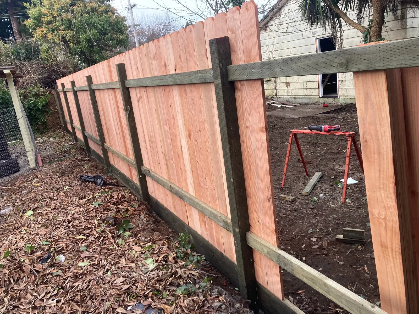 wooden fence under repair